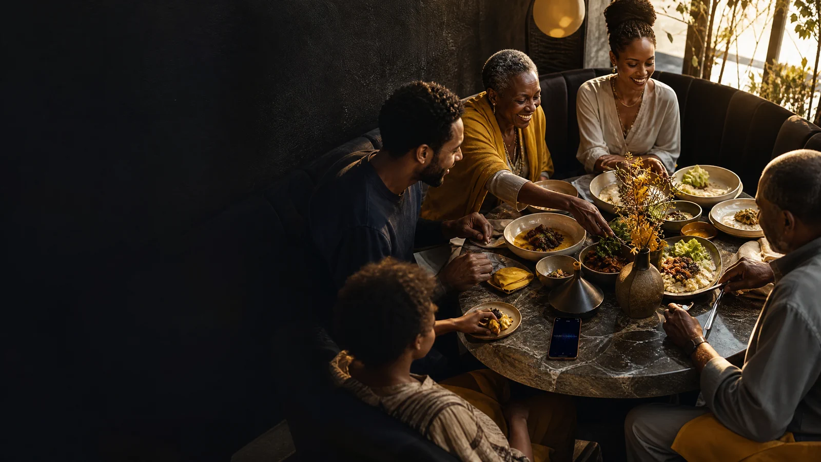 Guests at a modern restaurant table using Chapati